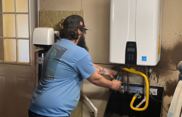 Services C&C Slab Leaks and Plumbing: Plumber Installing tankless water heater