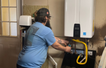 Tankless Water Heaters: C&C Slab Leaks and Plumbing, Plumber installing a tankless water heater